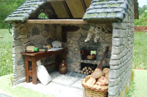 DSC_0006.JPG - The baker uses flour, water, yeast, and butter to make their bread. The table is made out of walnut tree that actually grew on my parents property.