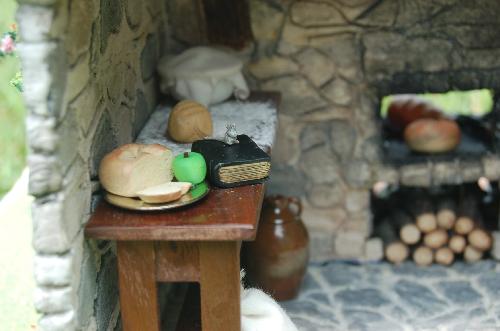 DSC_0009.JPG - The baker leaves a snack behind with the book that they're reading as they wait for dough to rise. A tiny visitor stops by for a snack.