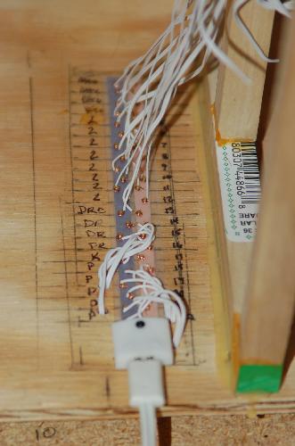 Sept24.JPG - All of the wires are attached to the brads. Each wire is labeled with the floor. Once I determine the actual light fixture will work, I plan on placing a dab of silicon gel on each brad to make sure the connections don't touch and stay put. The lead has also been attached.