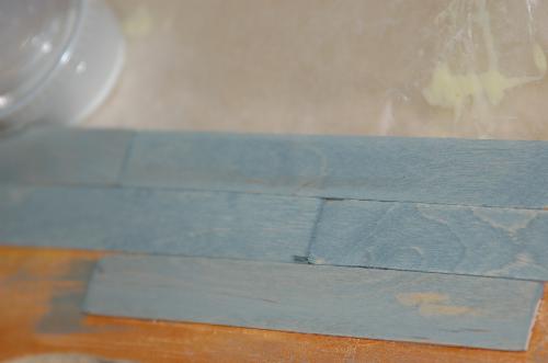 Sept17.JPG - I'm not sure how I'm going to do the floors, but I'm trying a couple of methods. The first is to attach sticks to a hard service like actual planks and stain.