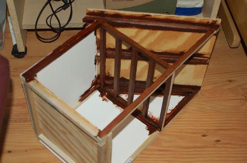 Sept29.JPG - Staining the rafters in the kitchen.