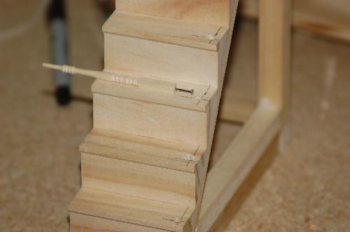 Sept16.JPG - I have pushed a small brad into the spindle and I have drilled a hole into the step. I plan on trying to get everything to lineup and stay there by gluing the brad into the hole when I assemble it.
