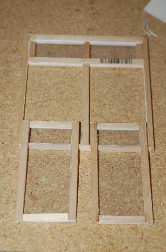 Sept22.jpg - One downstairs window is almost complete. I put the acetate between the frames and once I have the mullions glued on, I will glaze the panes with a glazing product from Micromark. I plan on hinging these windows so they open.