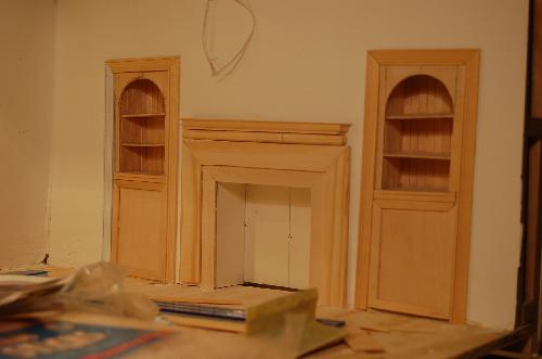 DSC_0009.JPG - The mantle and built-ins progress with decorative borders.