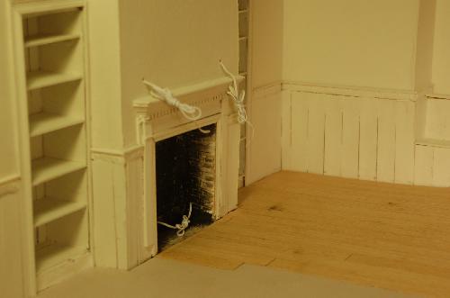 Woodwork001.JPG - Things are coming along. I've finished painting the inside of the fireplace.
